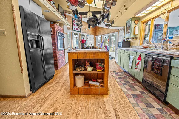 a bedroom with furniture and a large window