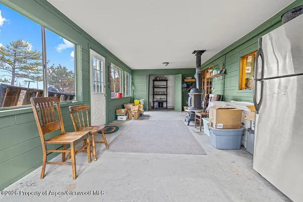 a living room with hard wood floors and a couch