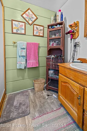 a bedroom with a bed and a table