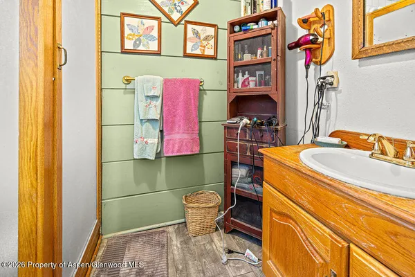 a bedroom with a bed and large window with the outer view