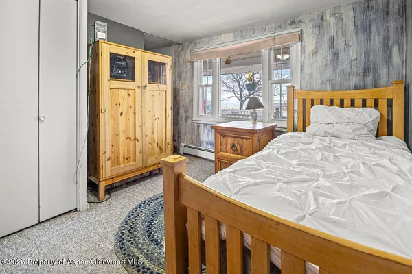 a bathroom with a shower and a sink