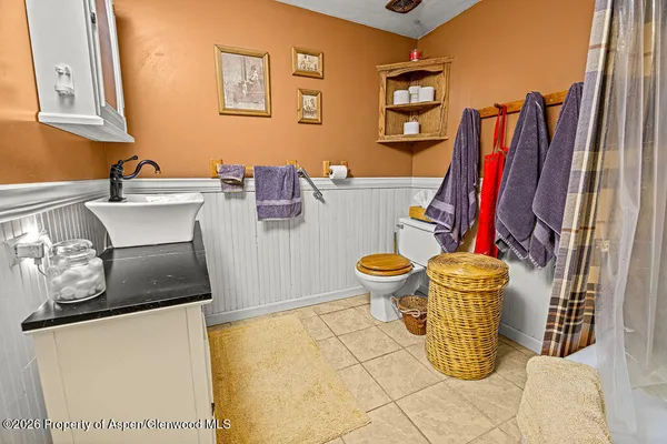 a bed sitting in a room next to a window