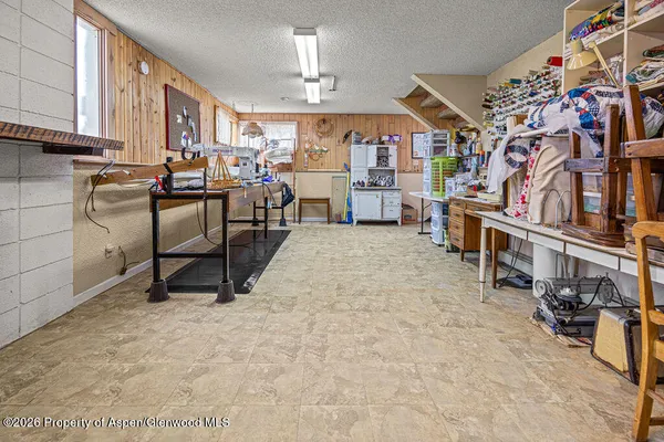 a living room with furniture hardwood floor and a large window