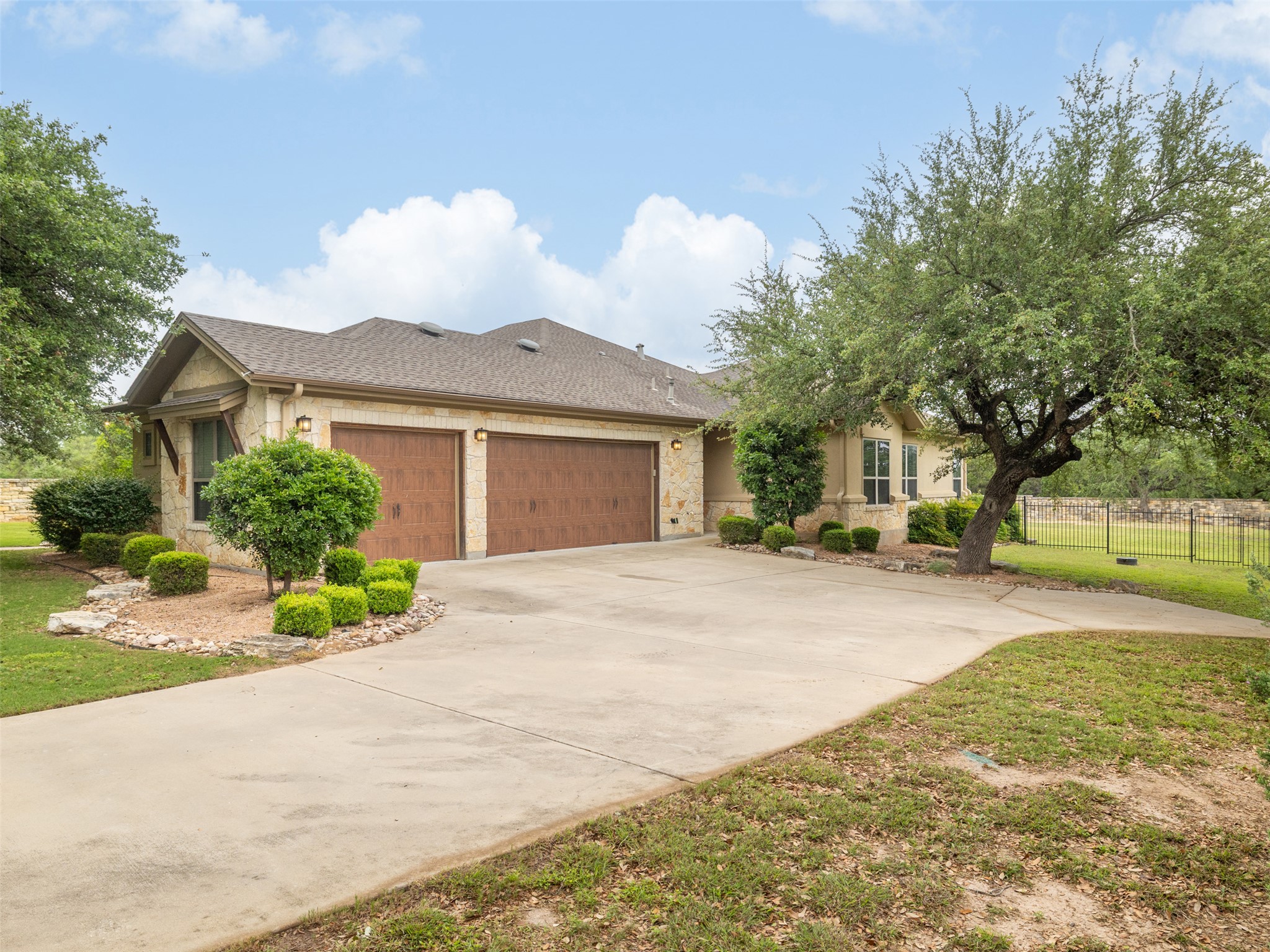 101 Aldea Street Georgetown, TX 78633 - Photo 25 of 40 A side-swing 3 car garage has plenty of room for larger vehicles to park.