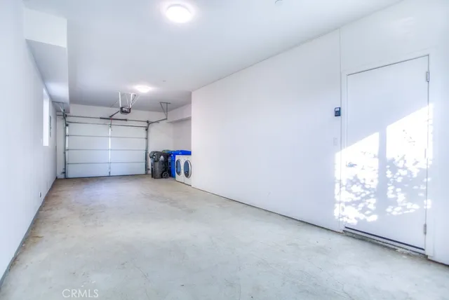 a view of a storage & utility room with washer and dryer