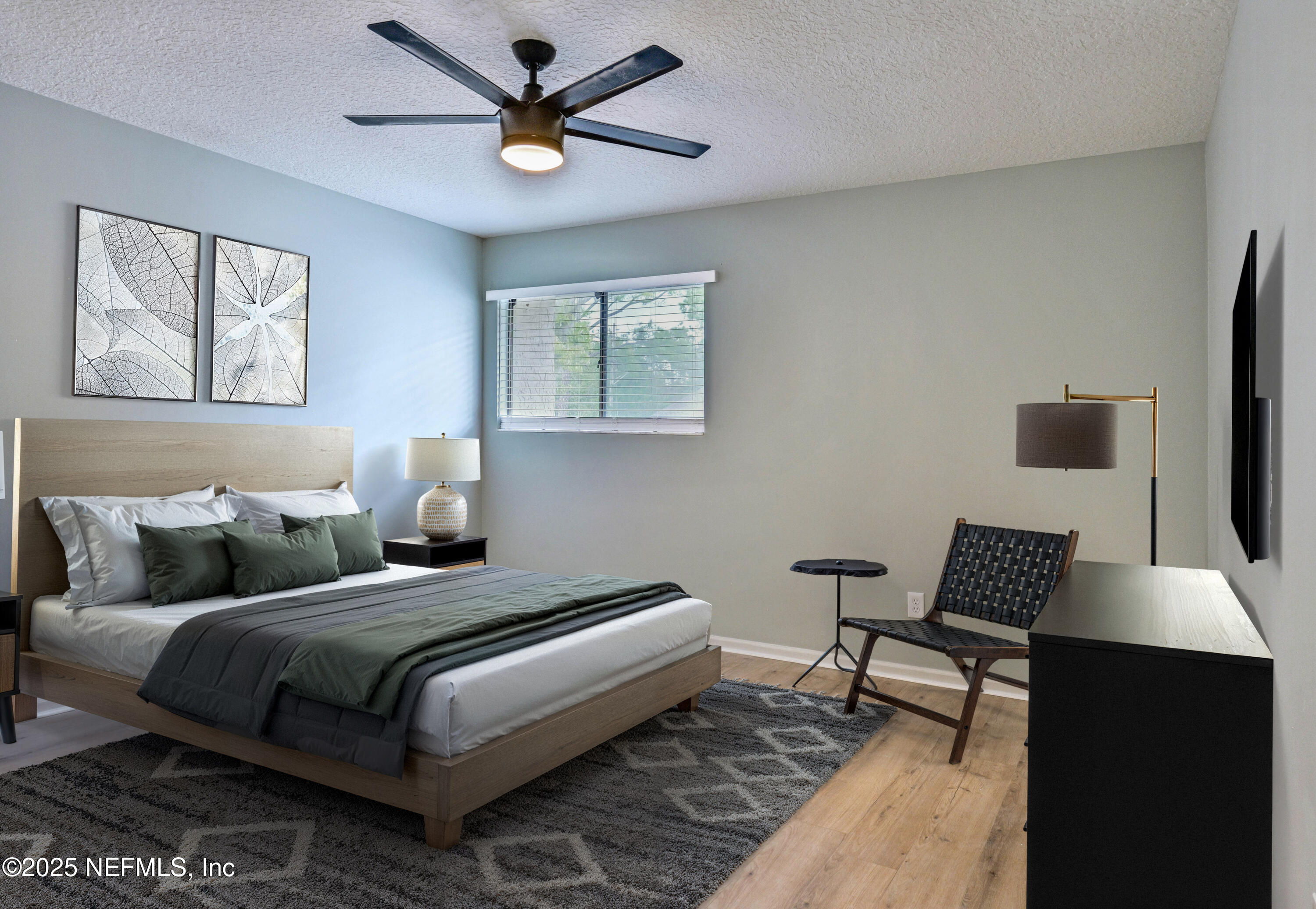 3801 Crown Point Road, Unit 3101 Jacksonville, FL 32257 - Photo 8 of 34 a bedroom with a bed and wooden floor