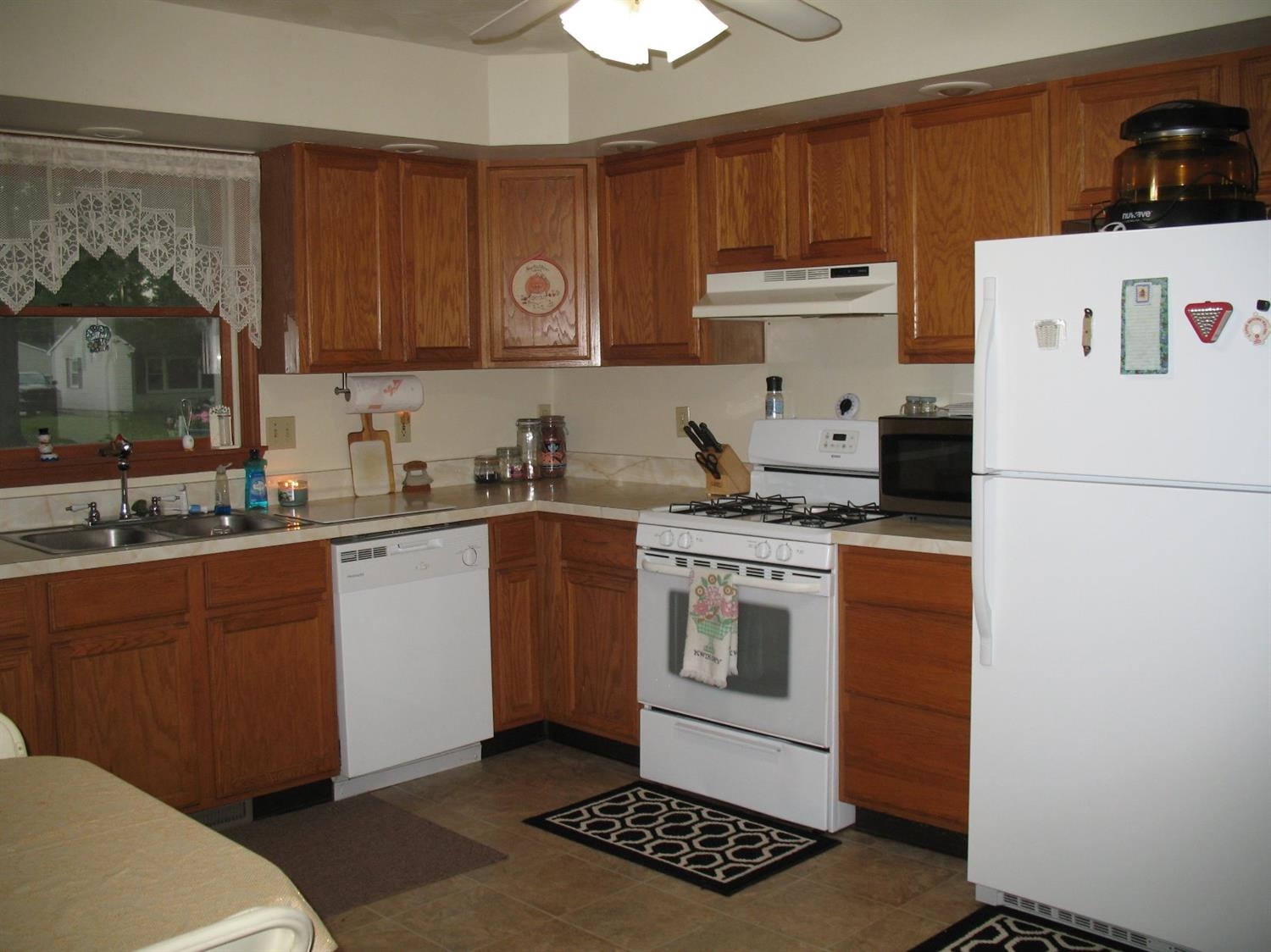 704-2 Juniper Road Valparaiso, IN 46385 - Photo 4 of 10 a kitchen with a sink a stove and cabinets