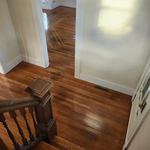 a view of lot of window and wooden floor