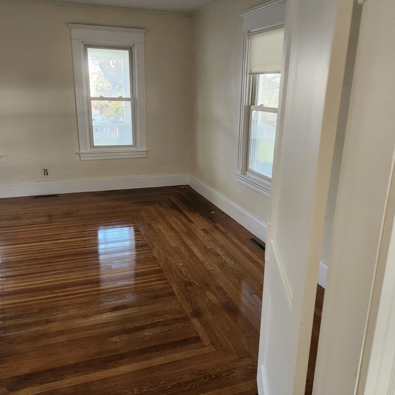 468 Springfield Street Agawam, MA 01001 - Photo 15 of 19 a view of wooden floor and windows in a room