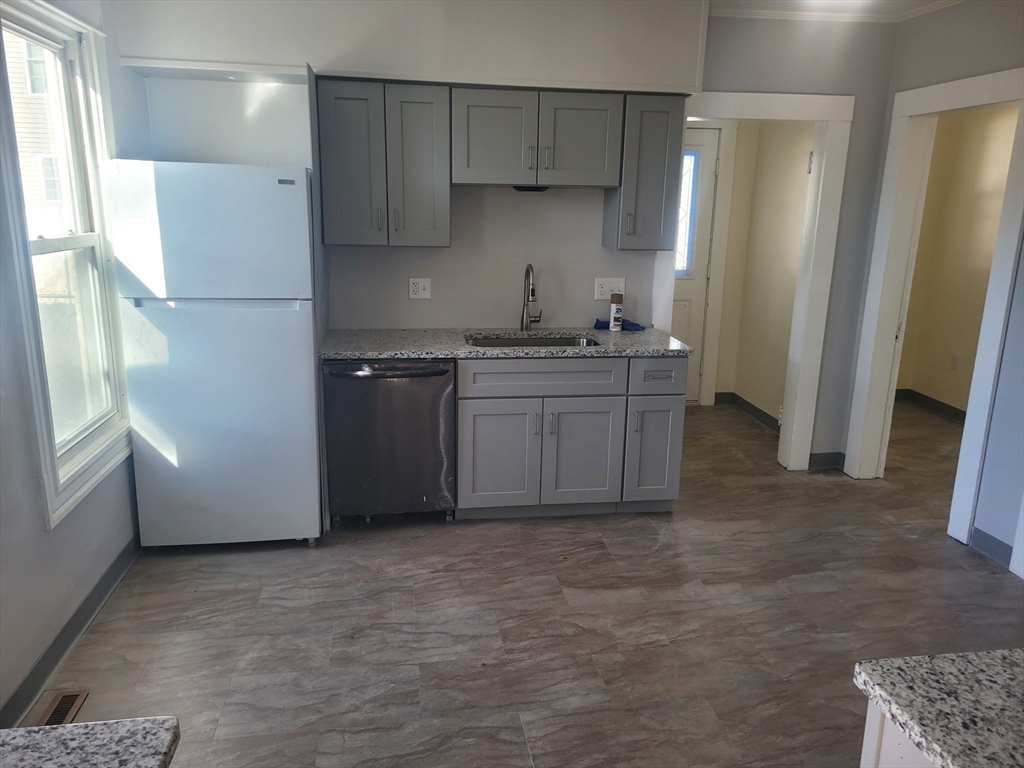 468 Springfield Street Agawam, MA 01001 - Photo 2 of 19 a kitchen with stainless steel appliances granite countertop a refrigerator a sink and a stove