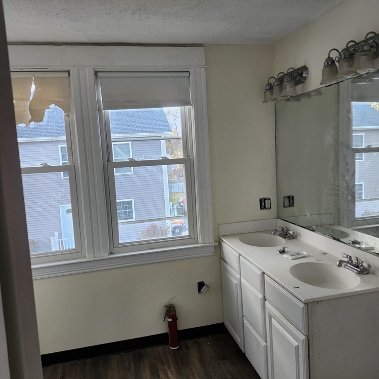 468 Springfield Street Agawam, MA 01001 - Photo 6 of 19 a bathroom with a sink and a mirror