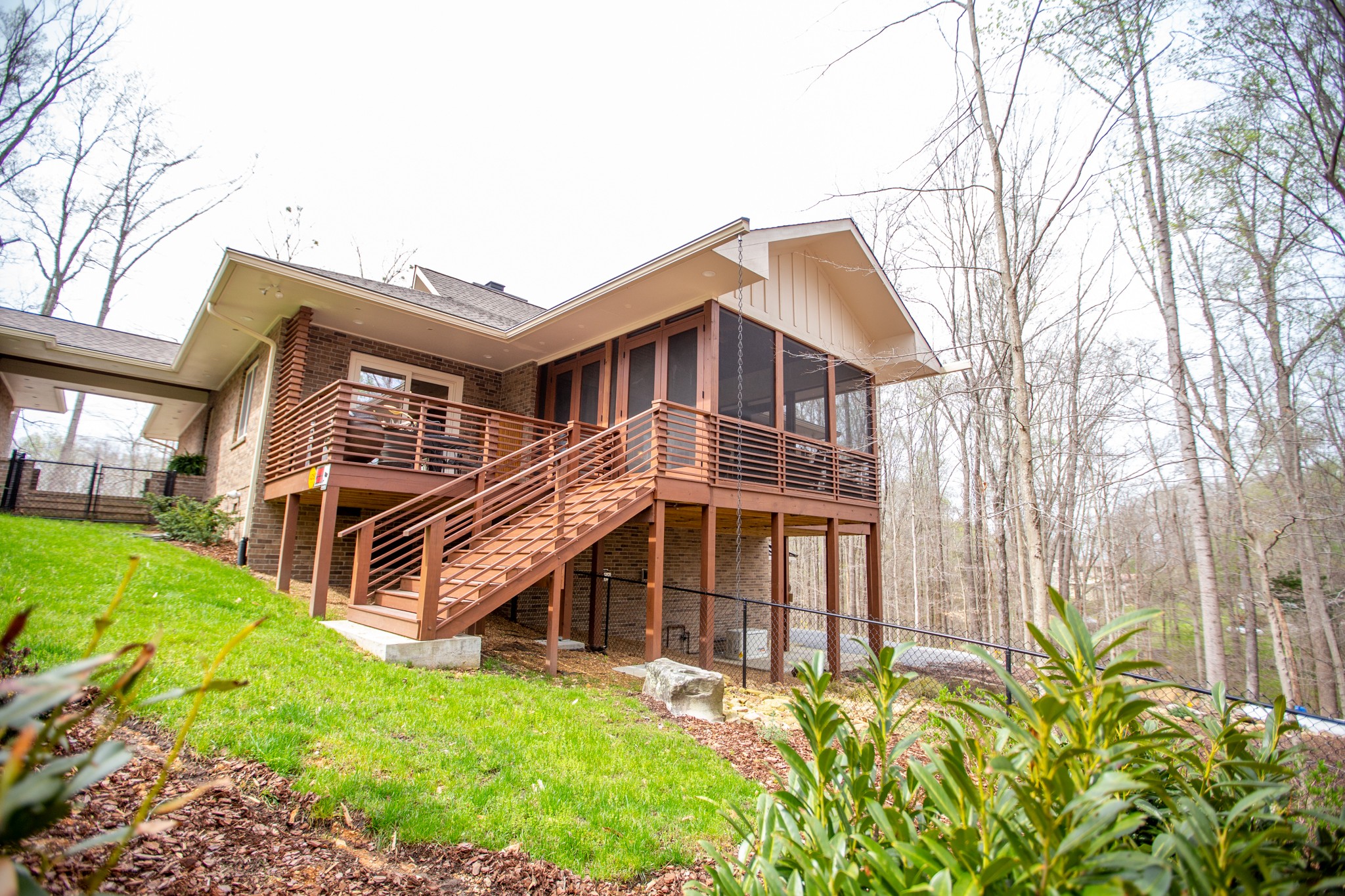 895 Sam Vineyard Road Bon Aqua, TN 37025 - Photo 11 of 60 a view of a house with a yard and wooden fence