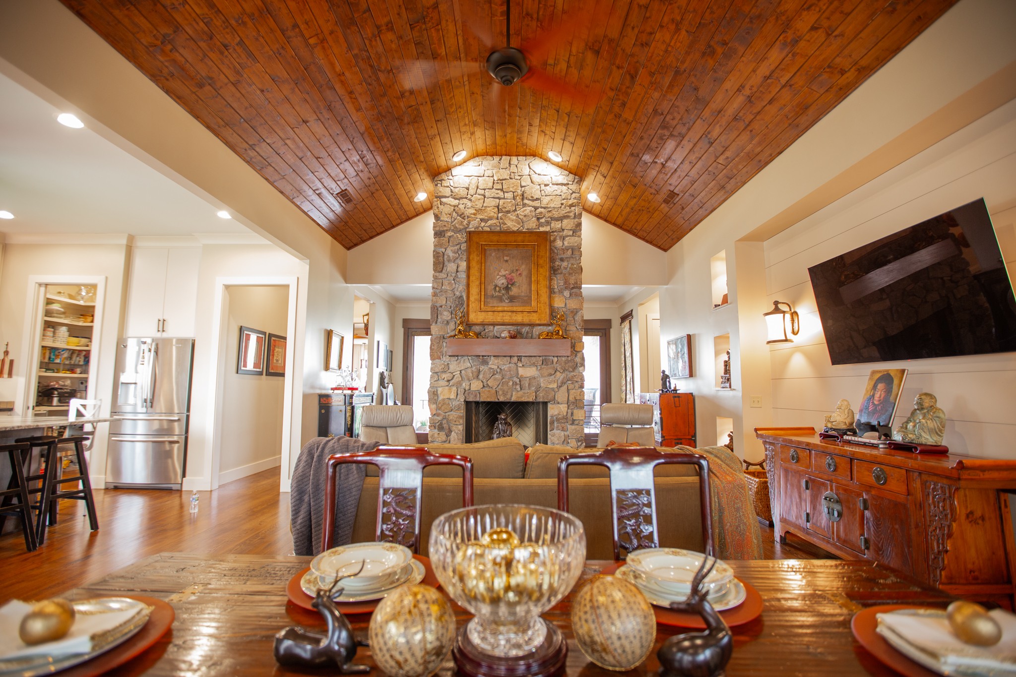895 Sam Vineyard Road Bon Aqua, TN 37025 - Photo 22 of 60 a living room with furniture a fireplace and a chandelier