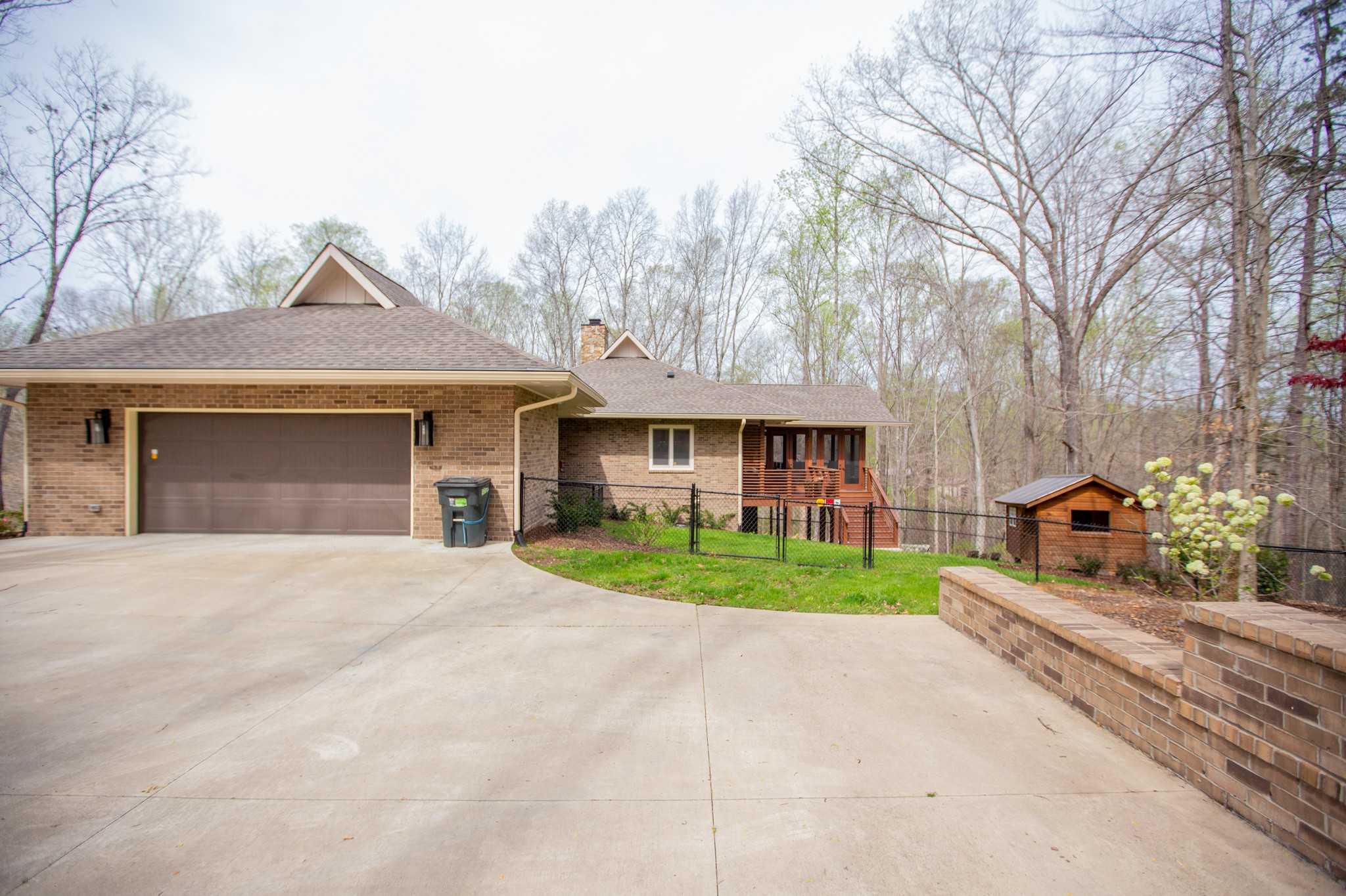895 Sam Vineyard Road Bon Aqua, TN 37025 - Photo 8 of 60 a front view of a house with a yard and garage