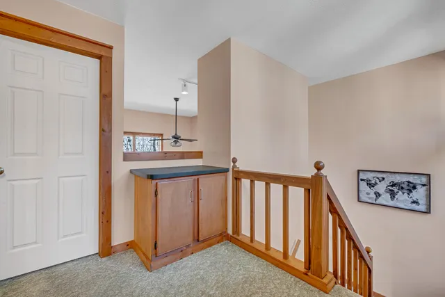 a view of a hallway with seating area