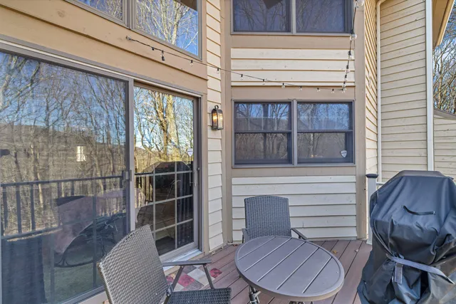 a view of a chair and table in the balcony