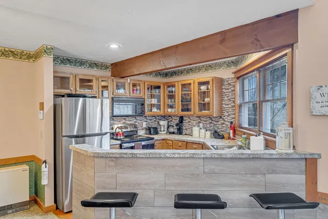 a kitchen with counter top space and stainless steel appliances