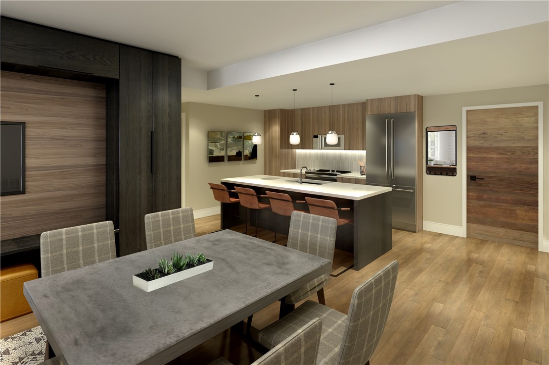 75 Hunki Dori Court, Unit W209 Keystone, CO 80435 - Photo 7 of 21 a kitchen with stainless steel appliances granite countertop a kitchen island a stove a table and chairs