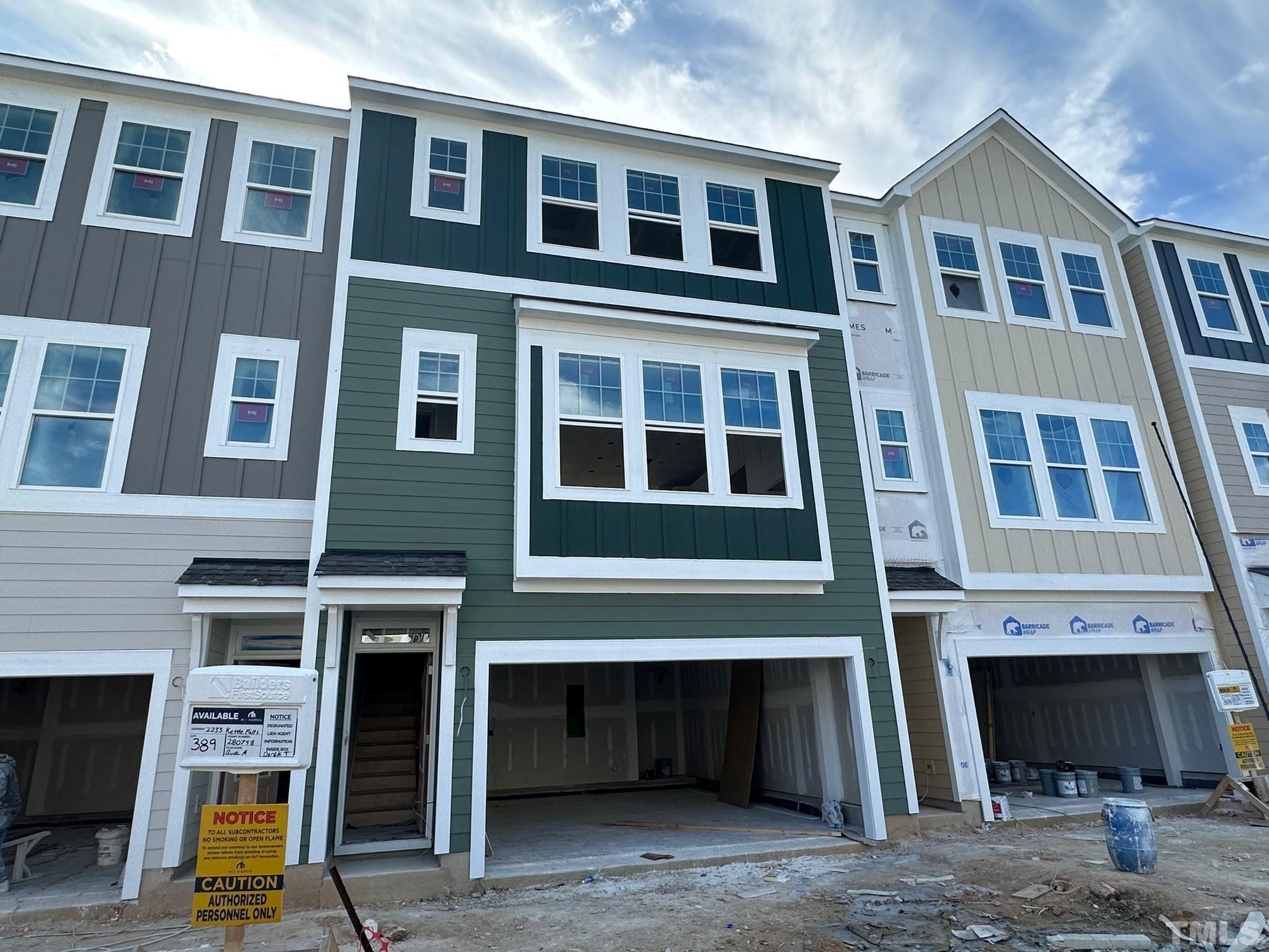 2233 Kettle Falls Station, Unit 389 Apex, NC 27502 - Photo 1 of 52 a front view of a building with many windows