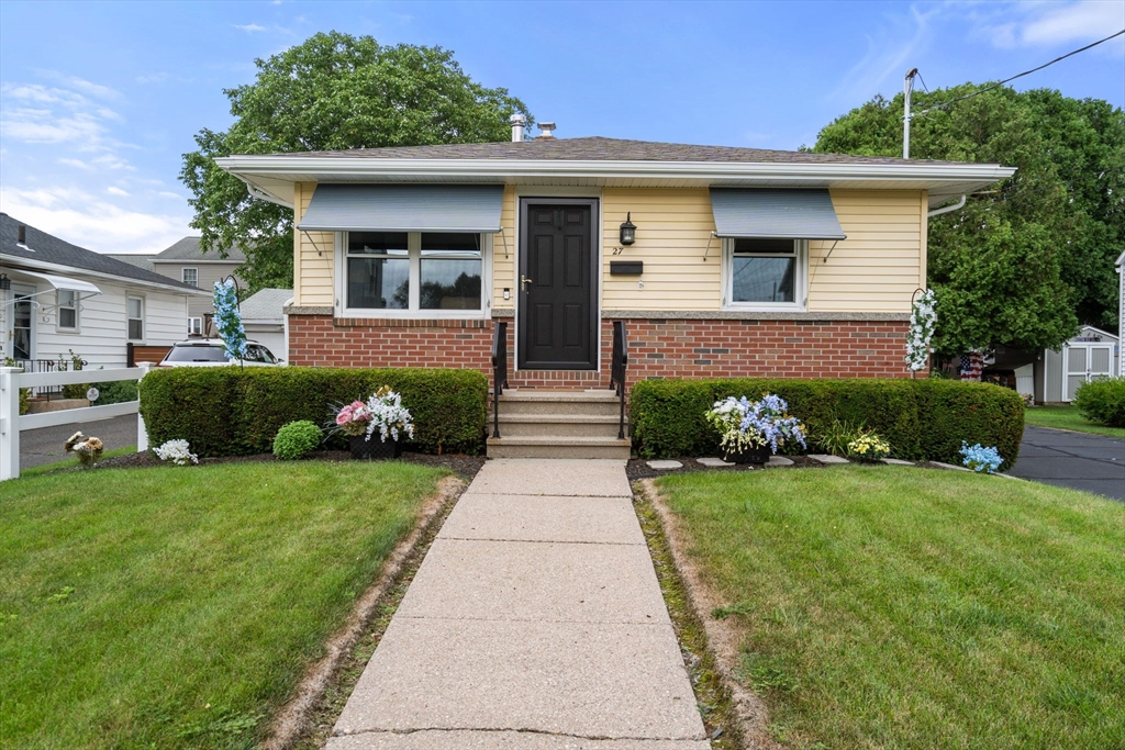 27 Moore Street Chicopee, MA 01013 - Photo 1 of 24 a front view of a house with garden