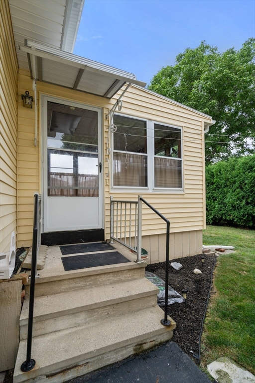 27 Moore Street Chicopee, MA 01013 - Photo 20 of 24 a view of a house with backyard and sitting area