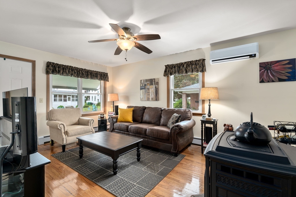 27 Moore Street Chicopee, MA 01013 - Photo 5 of 24 a living room with furniture a flat screen tv and a window