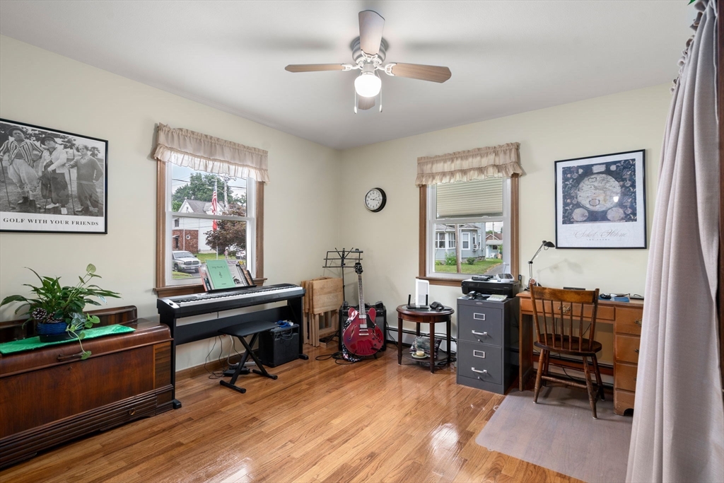 27 Moore Street Chicopee, MA 01013 - Photo 7 of 24 a living room with furniture piano and wooden floor