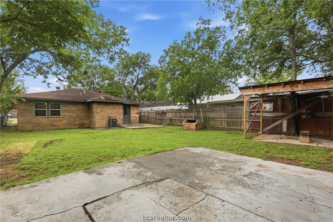 502 West 14th Street Bryan, TX 77803 - Photo 15 of 16 a view of a house with a back yard
