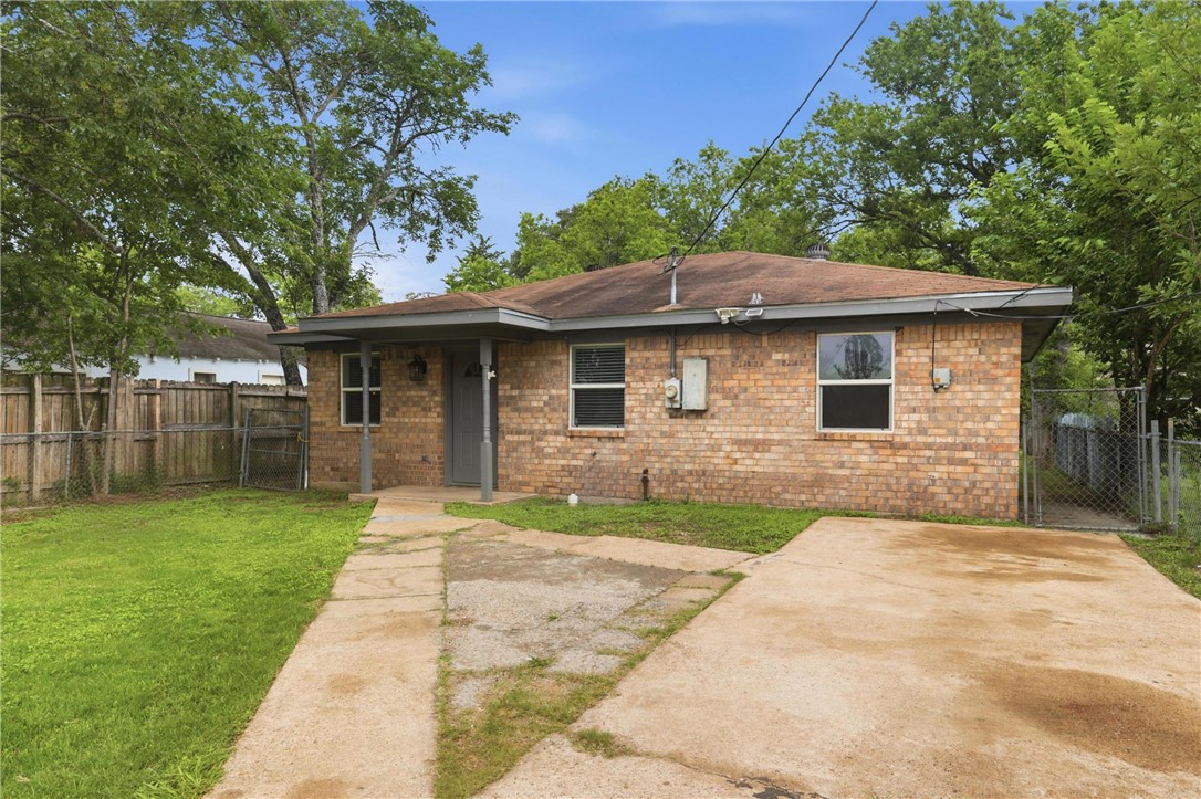 502 West 14th Street Bryan, TX 77803 - Photo 16 of 16 a front view of a house with a garden