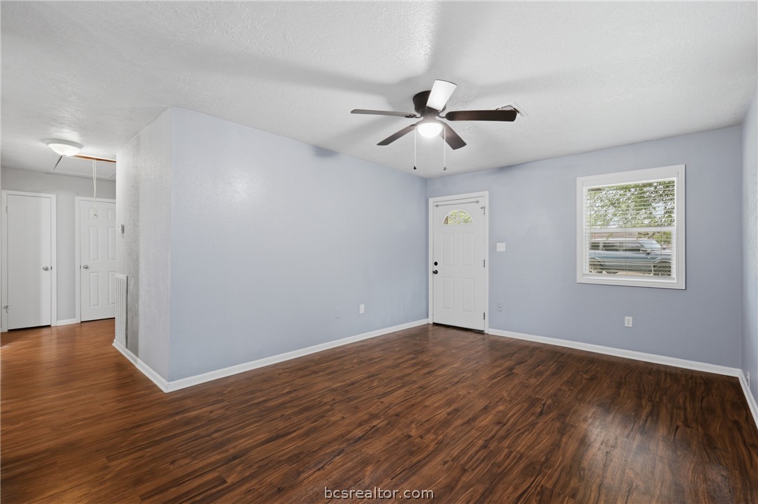 502 West 14th Street Bryan, TX 77803 - Photo 4 of 16 a view of an empty room with wooden floor and a ceiling fan