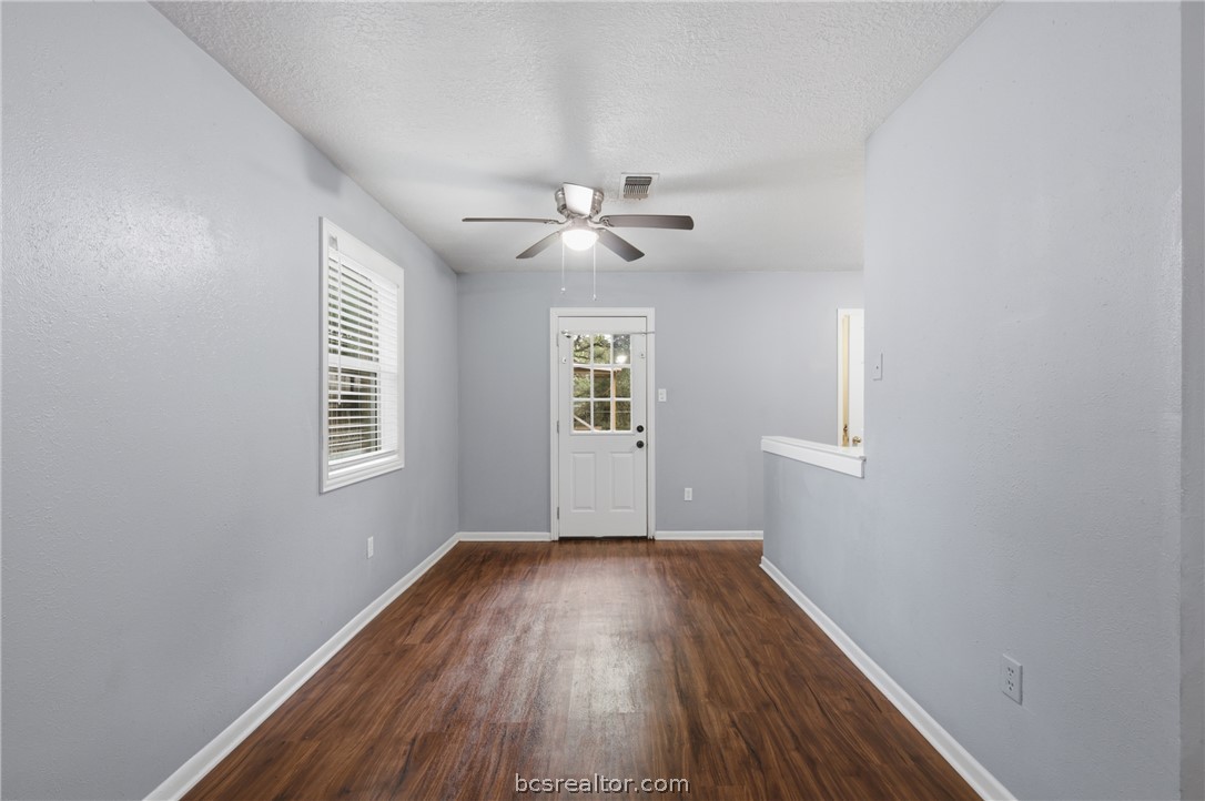 502 West 14th Street Bryan, TX 77803 - Photo 5 of 16 wooden floor in an empty room with a window