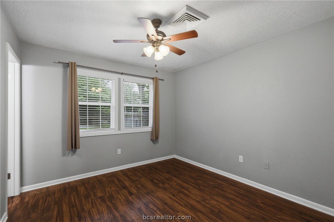 502 West 14th Street Bryan, TX 77803 - Photo 9 of 16 wooden floor in an empty room with a window
