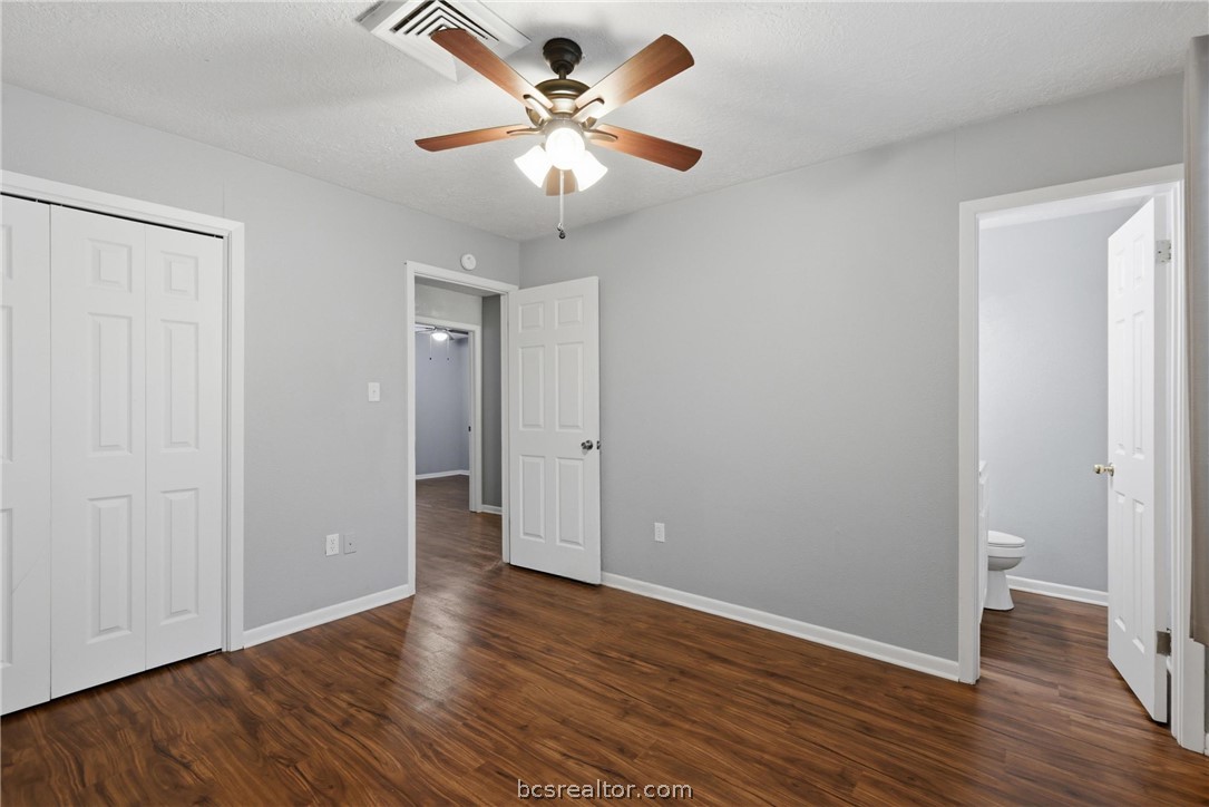 502 West 14th Street Bryan, TX 77803 - Photo 10 of 16 an empty room with wooden floor and ceiling fan