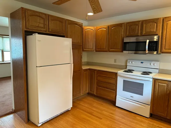 a view of a kitchen with a sink and a dishwasher