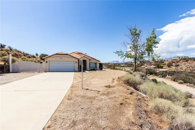 a living room with furniture a dining table and a flat screen tv