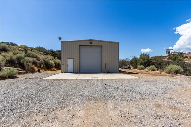 a view of a backyard of the house