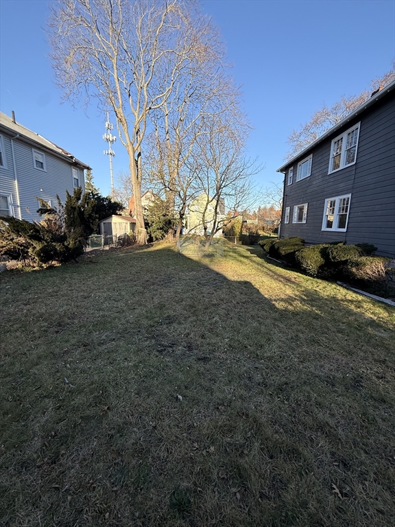 26 Malta Street, Unit 1 Boston, MA 02126 - Photo 3 of 14 a view of a yard with cars