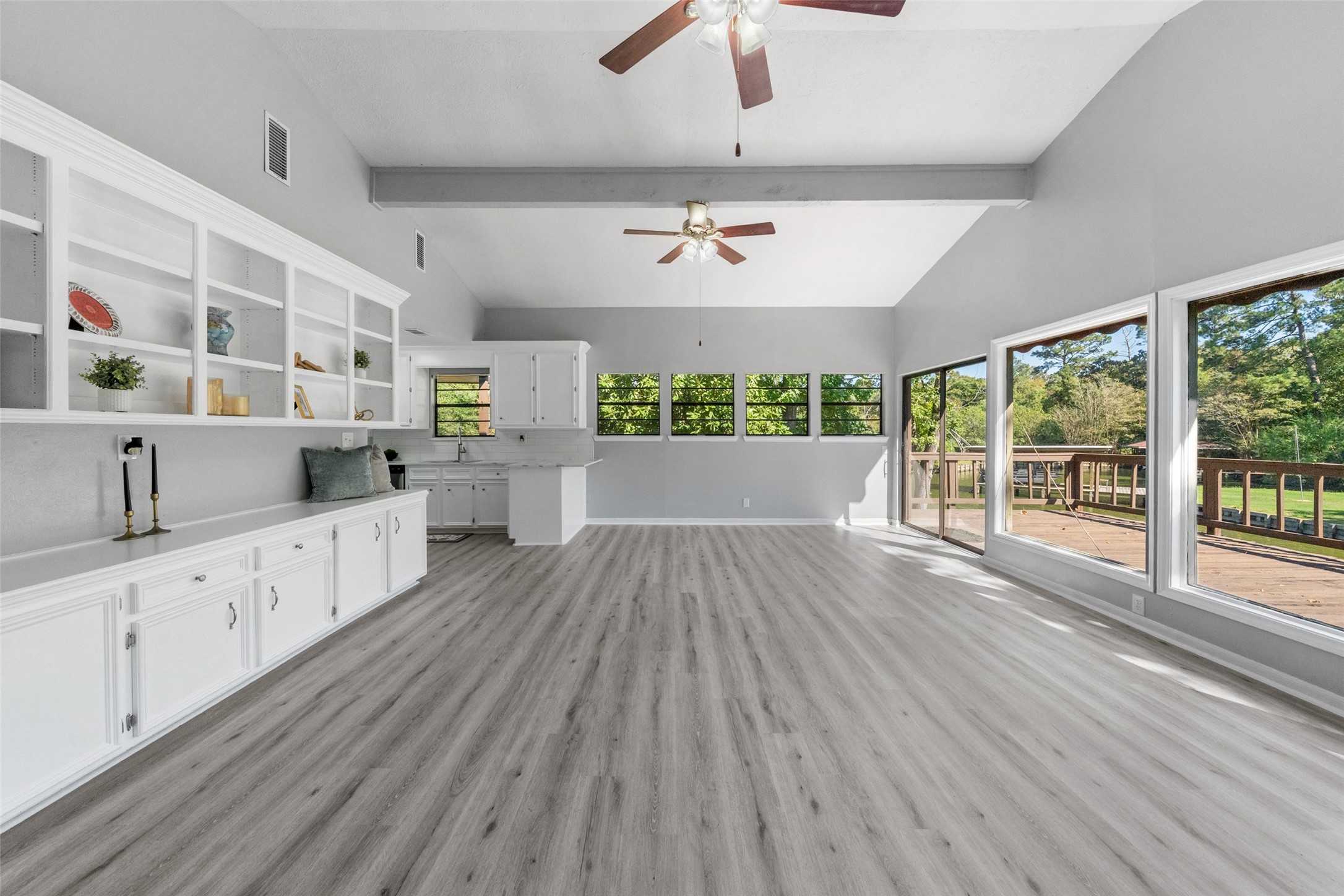 124 Timbo Trail Livingston, TX 77351 - Photo 14 of 45 a large space with chandelier fan and wooden floor