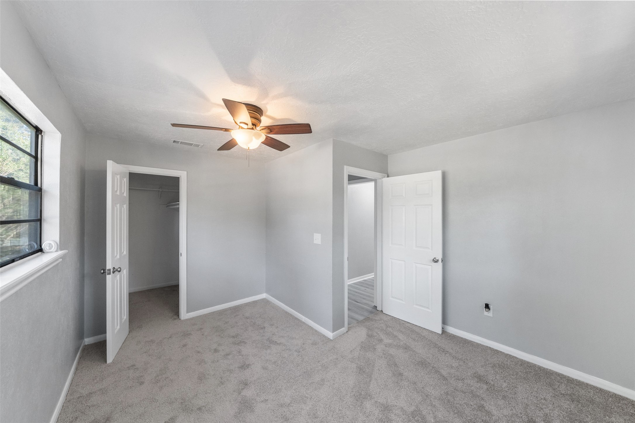 124 Timbo Trail Livingston, TX 77351 - Photo 17 of 45 a view of a livingroom with a ceiling fan and window