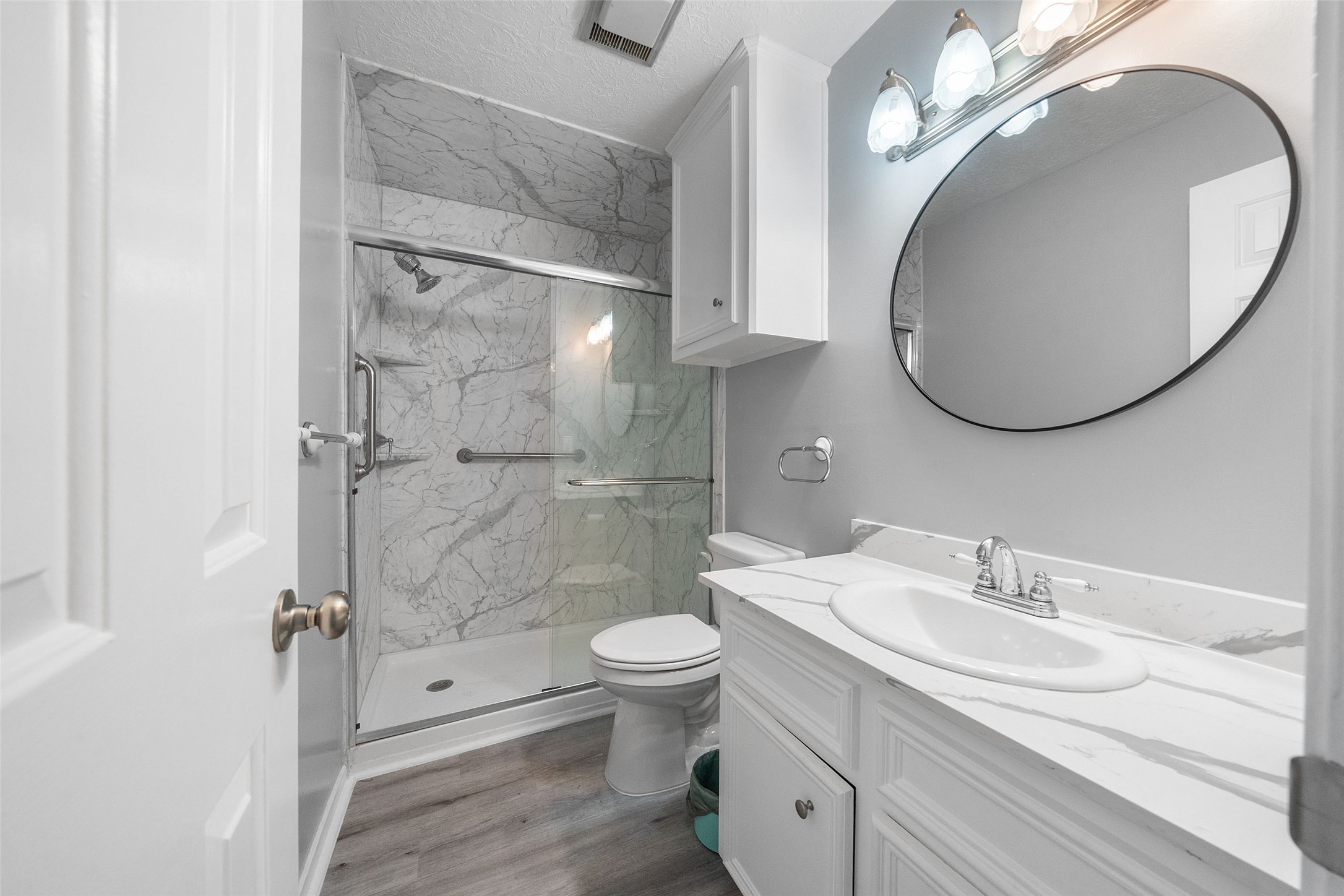 124 Timbo Trail Livingston, TX 77351 - Photo 20 of 45 a bathroom with a granite countertop sink toilet and a mirror
