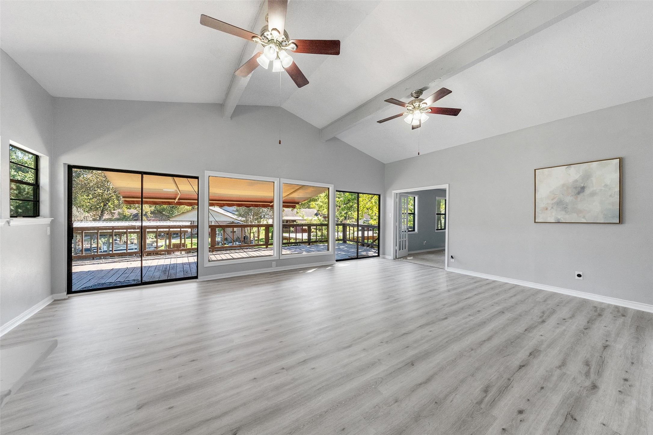 124 Timbo Trail Livingston, TX 77351 - Photo 25 of 45 a view of an empty room with a window and wooden floor