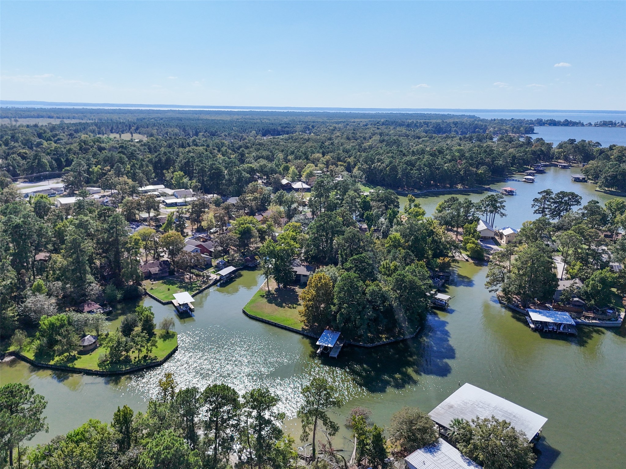 124 Timbo Trail Livingston, TX 77351 - Photo 3 of 45 an aerial view of a houses with a lake view