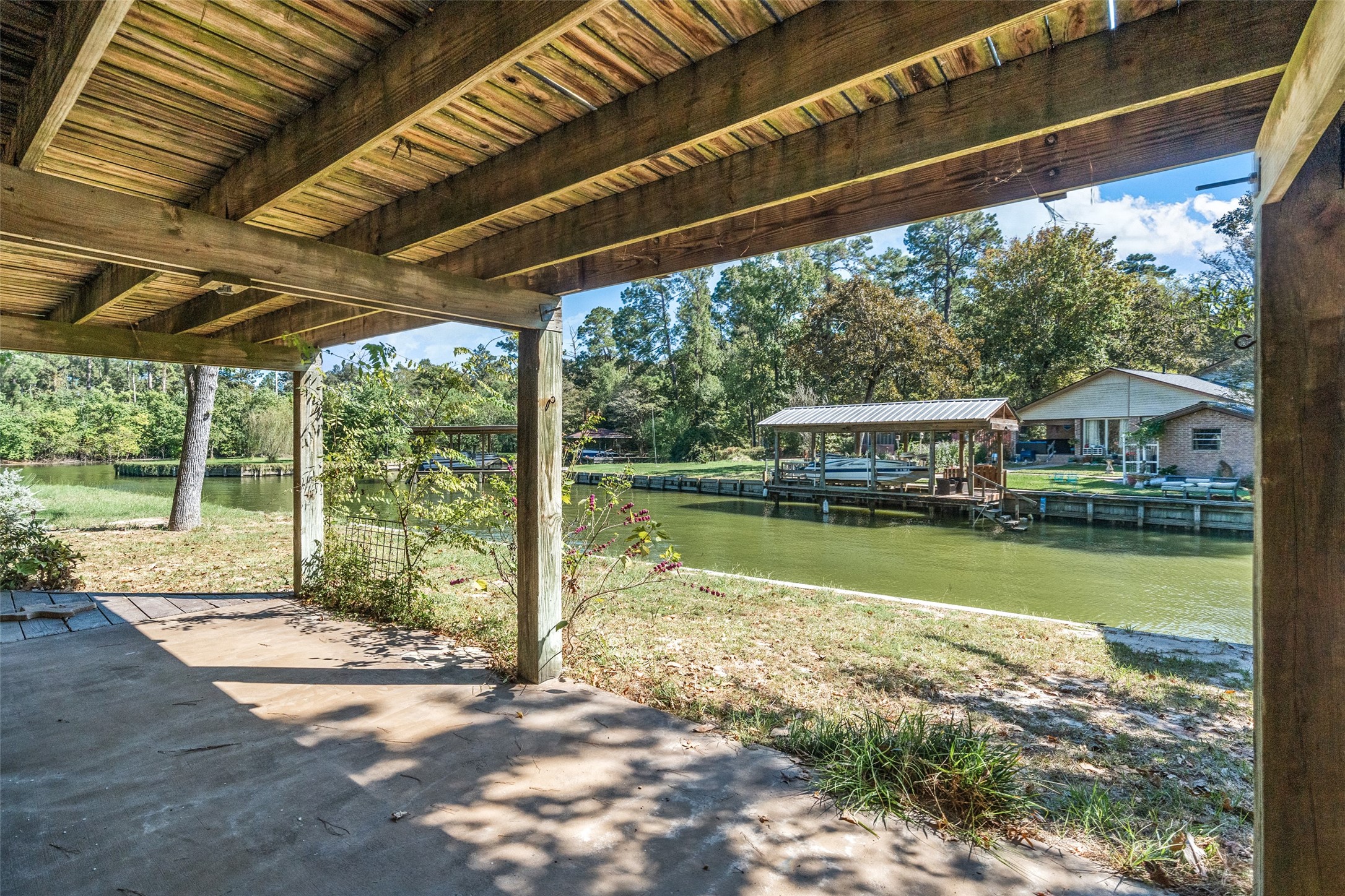 124 Timbo Trail Livingston, TX 77351 - Photo 39 of 45 a view of swimming pool with lawn chairs and plants