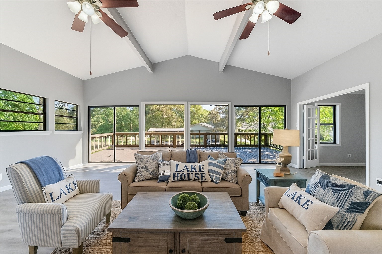 124 Timbo Trail Livingston, TX 77351 - Photo 4 of 45 a living room with furniture a ceiling fan and a large window