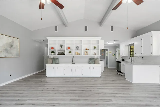 a spacious bathroom with a double vanity sink and a mirror