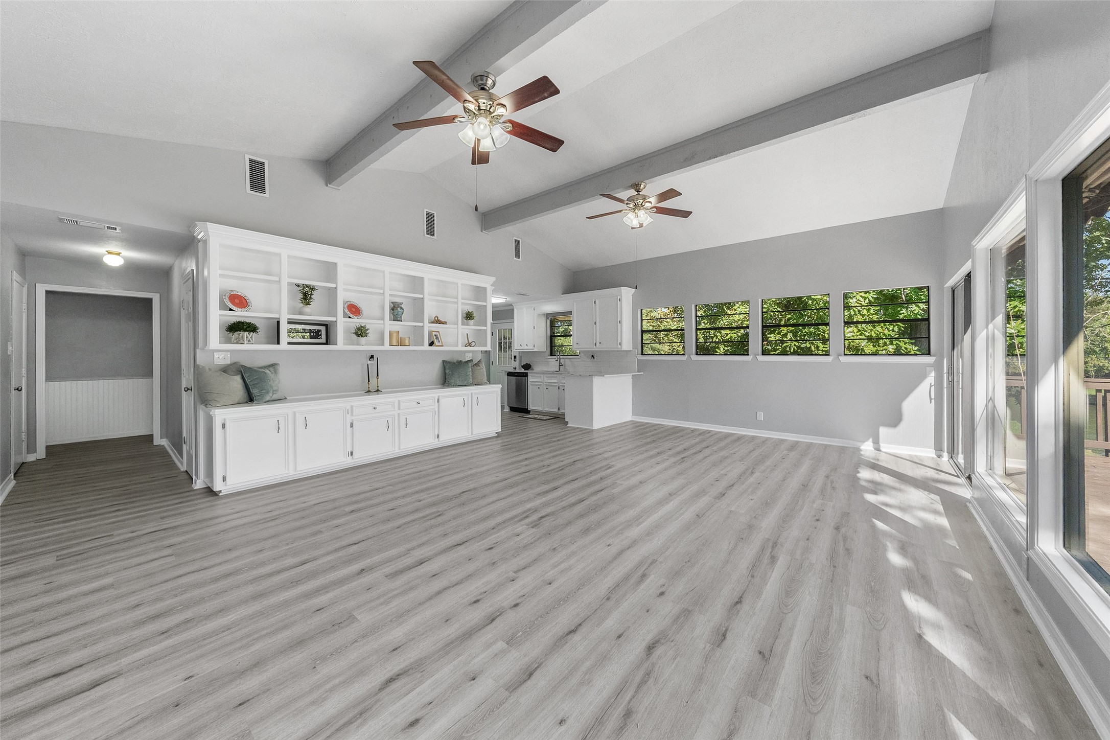 124 Timbo Trail Livingston, TX 77351 - Photo 9 of 45 a view of a living room and kitchen with a large window