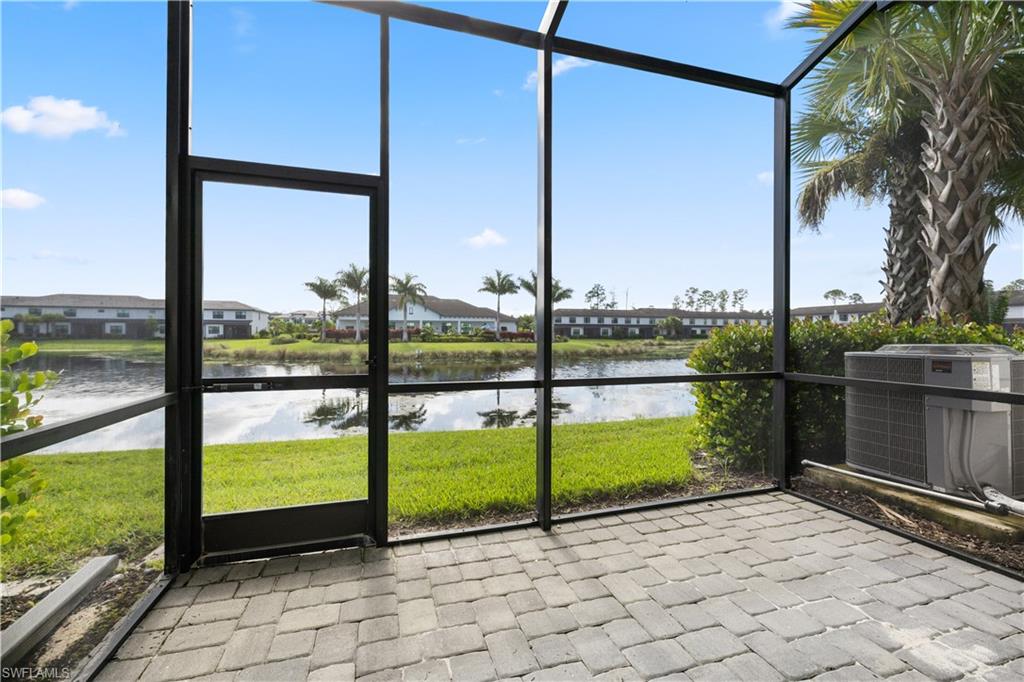 7548 Carnegie Way Naples, FL 34119 - Photo 19 of 20 Screened in lanai with lake view