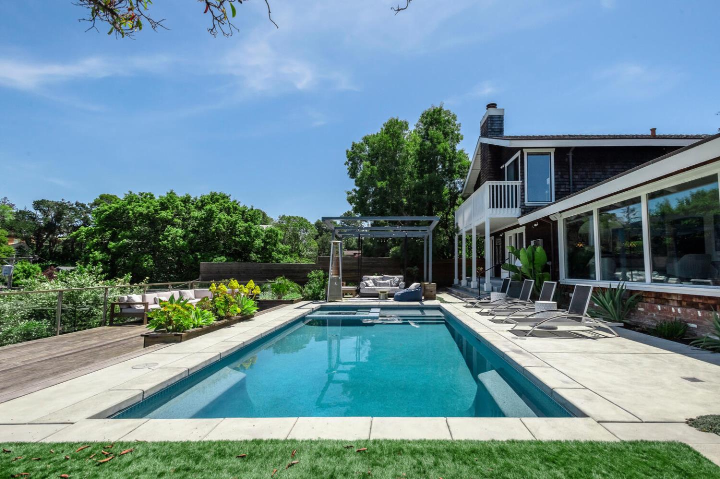 2651 Summit Drive Burlingame, CA 94010 - Photo 1 of 34 a view of swimming pool with outdoor seating and a garden