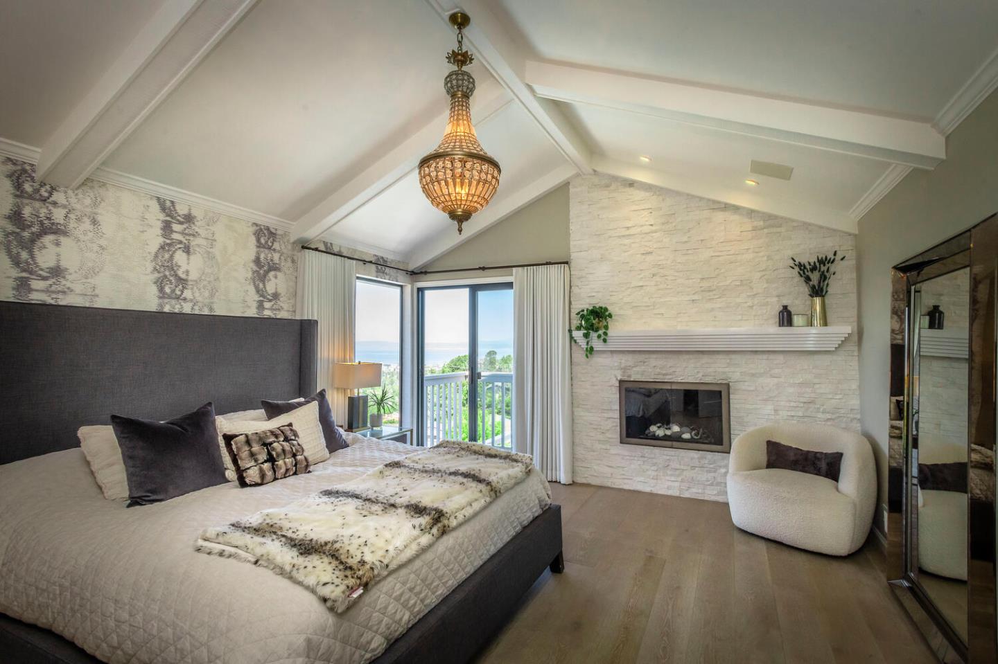 2651 Summit Drive Burlingame, CA 94010 - Photo 14 of 34 a spacious bedroom with a bed and a fireplace