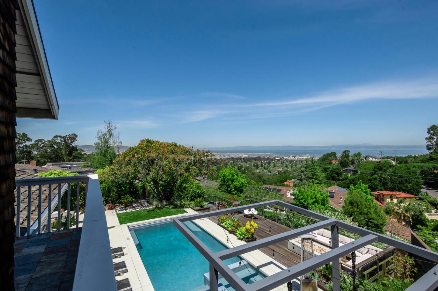 2651 Summit Drive Burlingame, CA 94010 - Photo 16 of 34 a view of a balcony with two chairs and a table